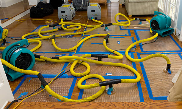 Professional Flood Damage Restoration technician working in Warsaw, IN